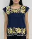 Blusa azul marino con flores y ramas doradas