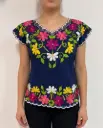 Blusa azul marino con flores multicolor bordadas