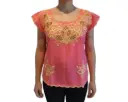 Blusa color salmón con flores amarillas